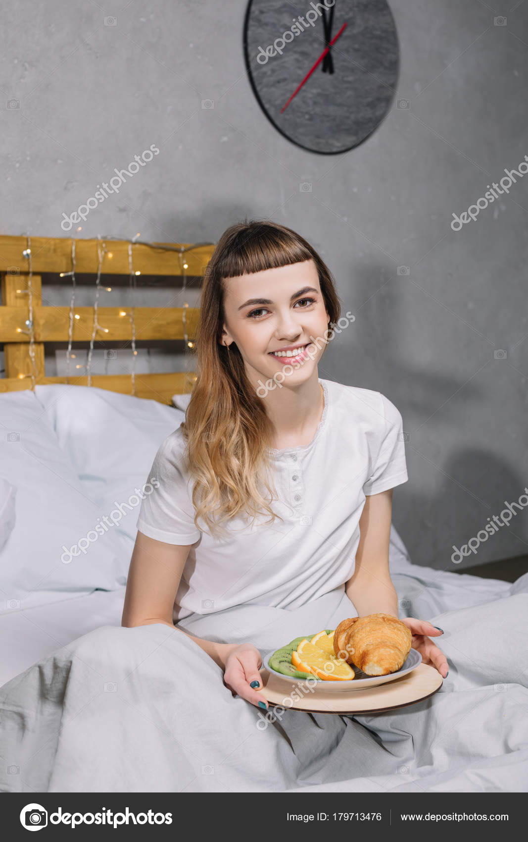 Smiling Girl Sitting Bed Breakfast Stock Photo by ©NastyaBerezen 179713476