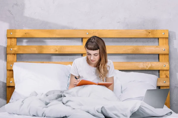 Girl Sitting Bed Writing Something Notebook — Stock Photo, Image