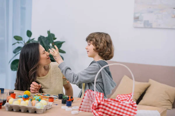 Son Playing Mother While Preparing Easter Eggs — Stock Photo, Image