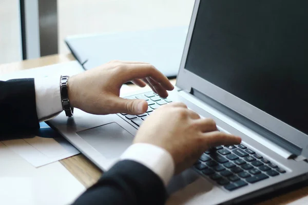 businessman typing on laptop.people and technology