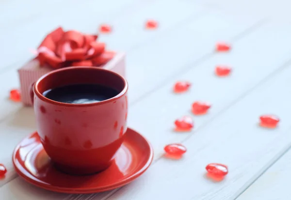 Close up. a Cup of coffee on a white wooden table . — стоковое фото