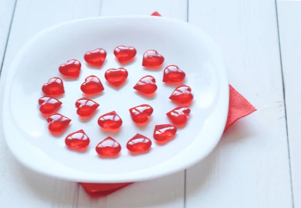 Close up. Red hearts on a white plate.photo with place for text . — стоковое фото