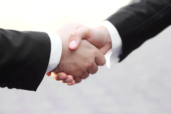 close up.business handshake .isolated on white background.