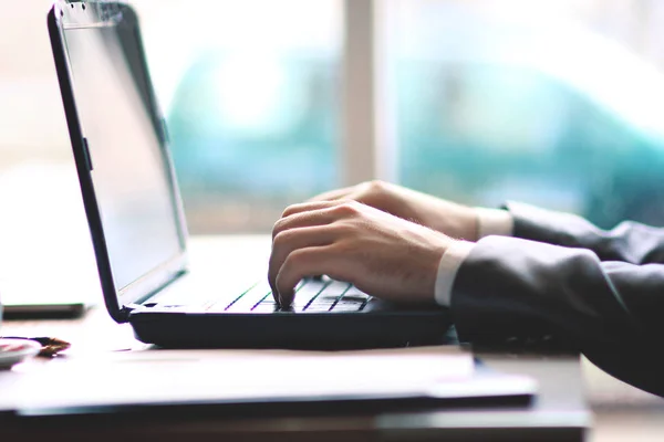 businessman typing on laptop.people and technology