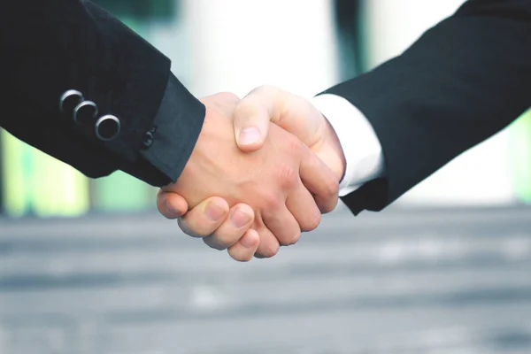 close up. handshake business partners on blurred background