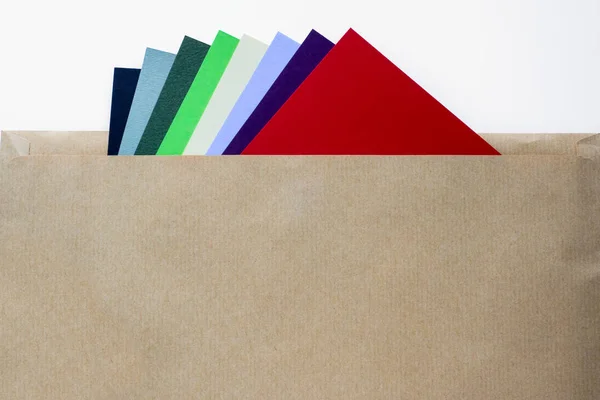 Colored papers in envelope — Stock Photo, Image