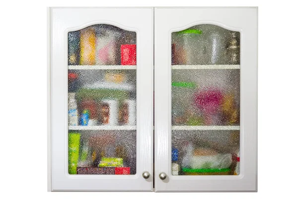 Old kitchen cupboard full of crockery and kitchen utensils