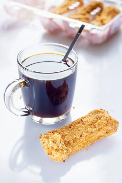 Black Coffee with eclairs — Stock Photo, Image