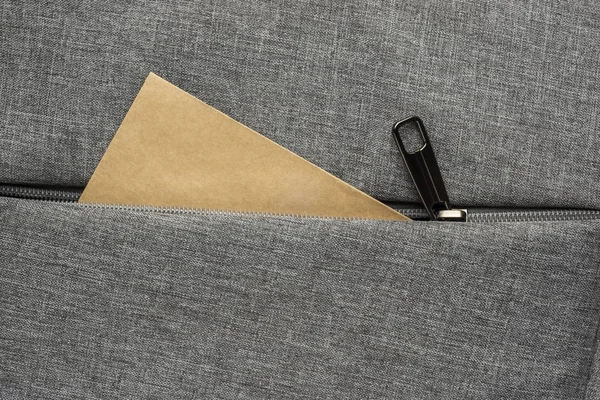 Envelope Peeks Out Zipper Pocket Gray Textured Fabric Background — Stock Photo, Image