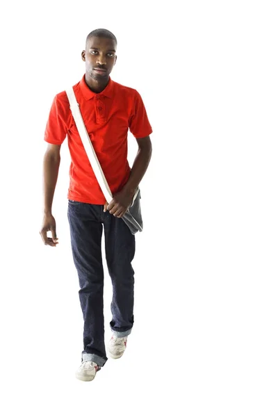 African male wearing a red shirt, denim jeans and has a shoulder Royalty Free Stock Photos