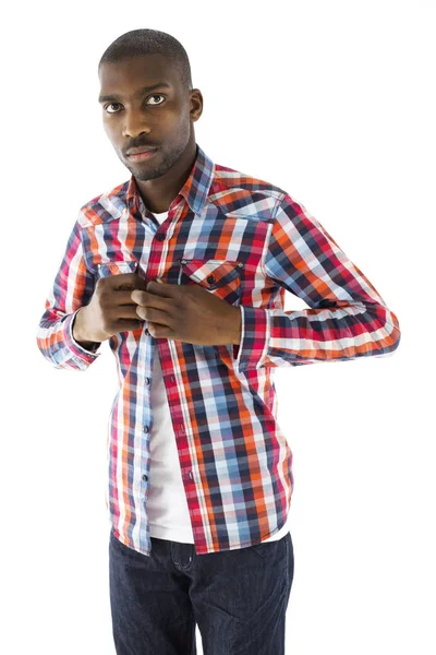 African male unbuttoning his checkered shirt — Stock Photo, Image
