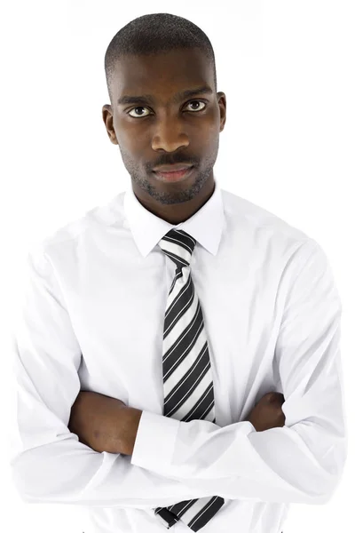 Portrait of an African male businessman in a studio wearing a wh — Stock Photo, Image