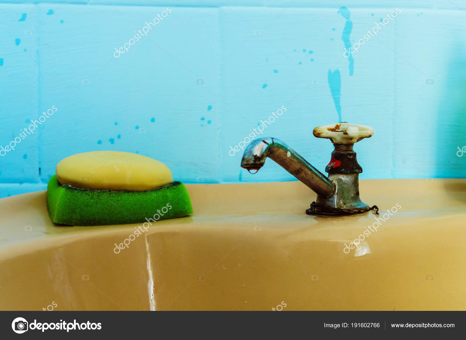 An Old Untreated Bathroom With One Rusty Sink And A Leaking