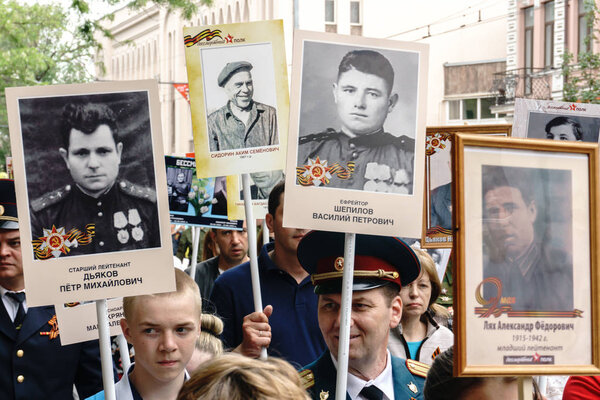 Rostov-on-Don / Russia - 9 May 2018: People in the procession of the Immortal Regiment carry portraits of the participants of World War II who are no longer alive as a sign of memory and sorrow