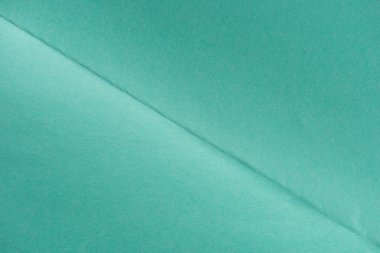 close-up shot of turquoise color folded paper for background clipart