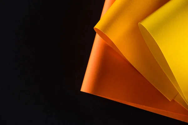 Orange Yellow Colored Papers Isolated Black — стоковое фото