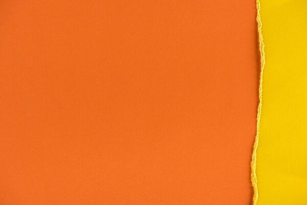 close-up shot of orange and yellow paper layers for background