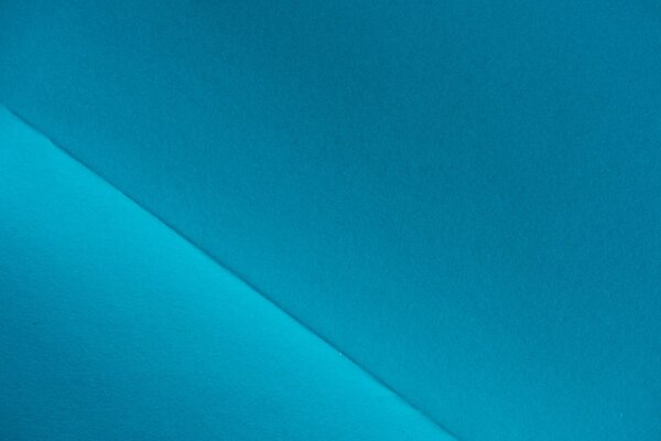 close-up shot of folded blue paper for background