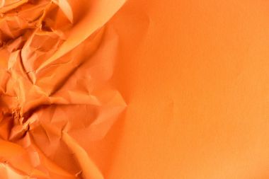 close-up shot of orange crumpled paper for background clipart