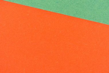 close-up shot of orange and green paper layers for background clipart