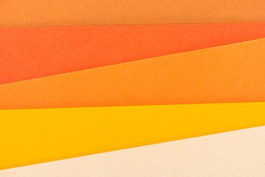 close-up shot of orange shades paper layers for background clipart