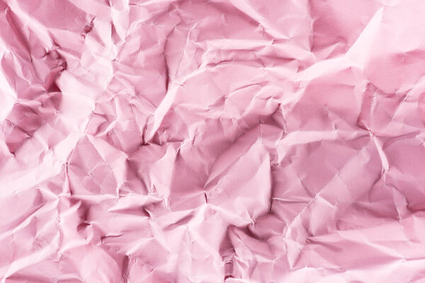 close-up shot of crumpled pink paper for background