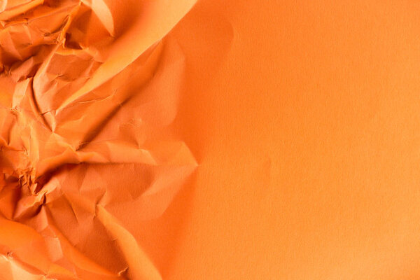 close-up shot of orange crumpled paper for background