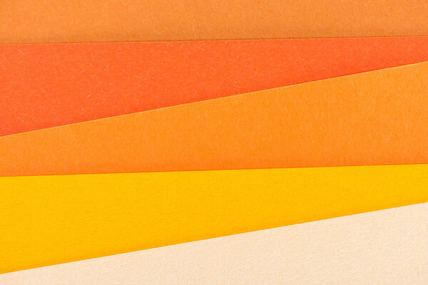 close-up shot of orange shades paper layers for background