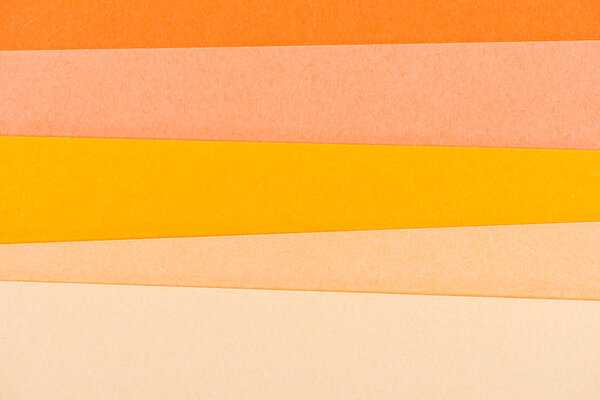 Крупный план оранжевых оттенков слоев бумаги для фона
