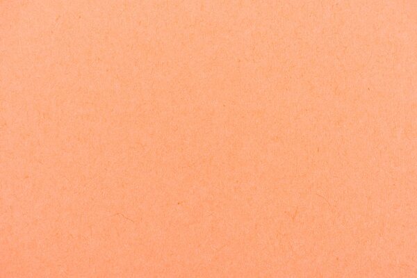 texture of peach-orange color paper as background