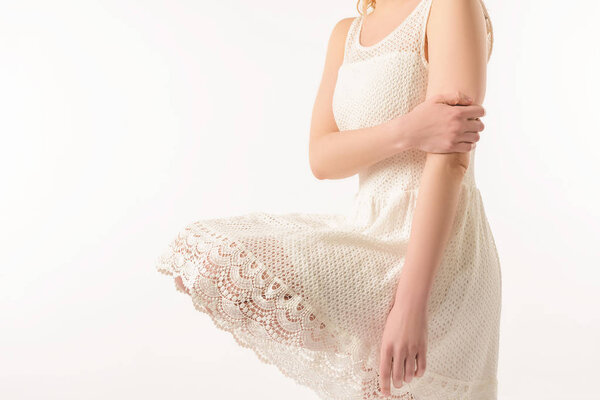 cropped view of elegant girl in white lace dress, isolated on white