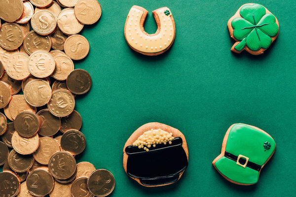 top view of icing cookies and golden coins, st patricks day concept