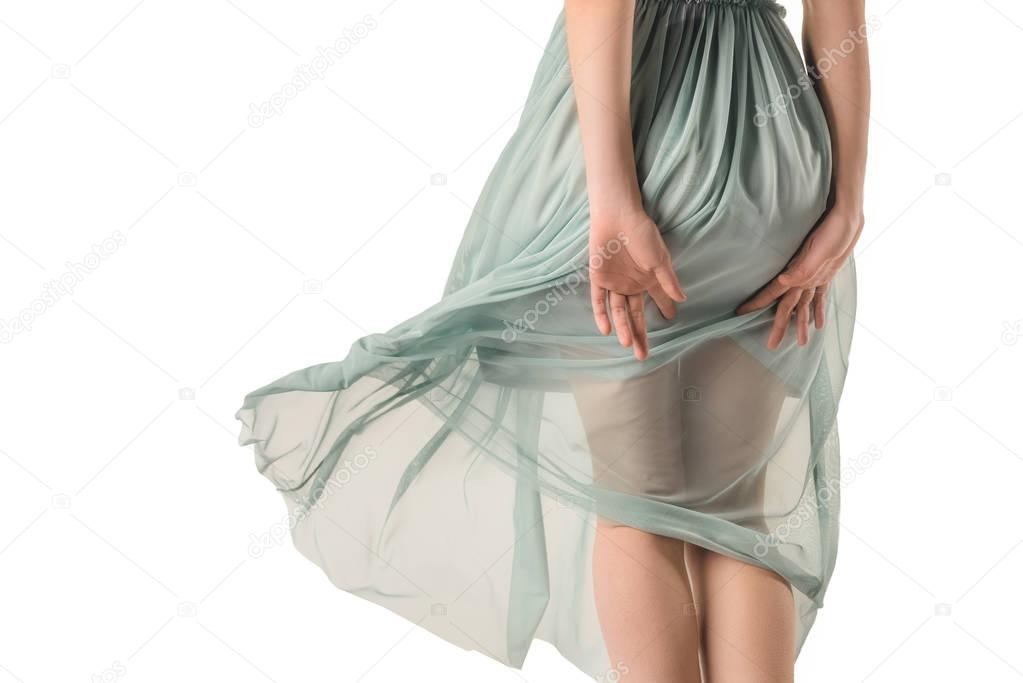 rear view of girl in transparent blue dress, isolated on white