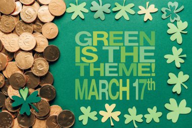 flat lay with golden coins and green is the theme, march 17th lettering on green background clipart