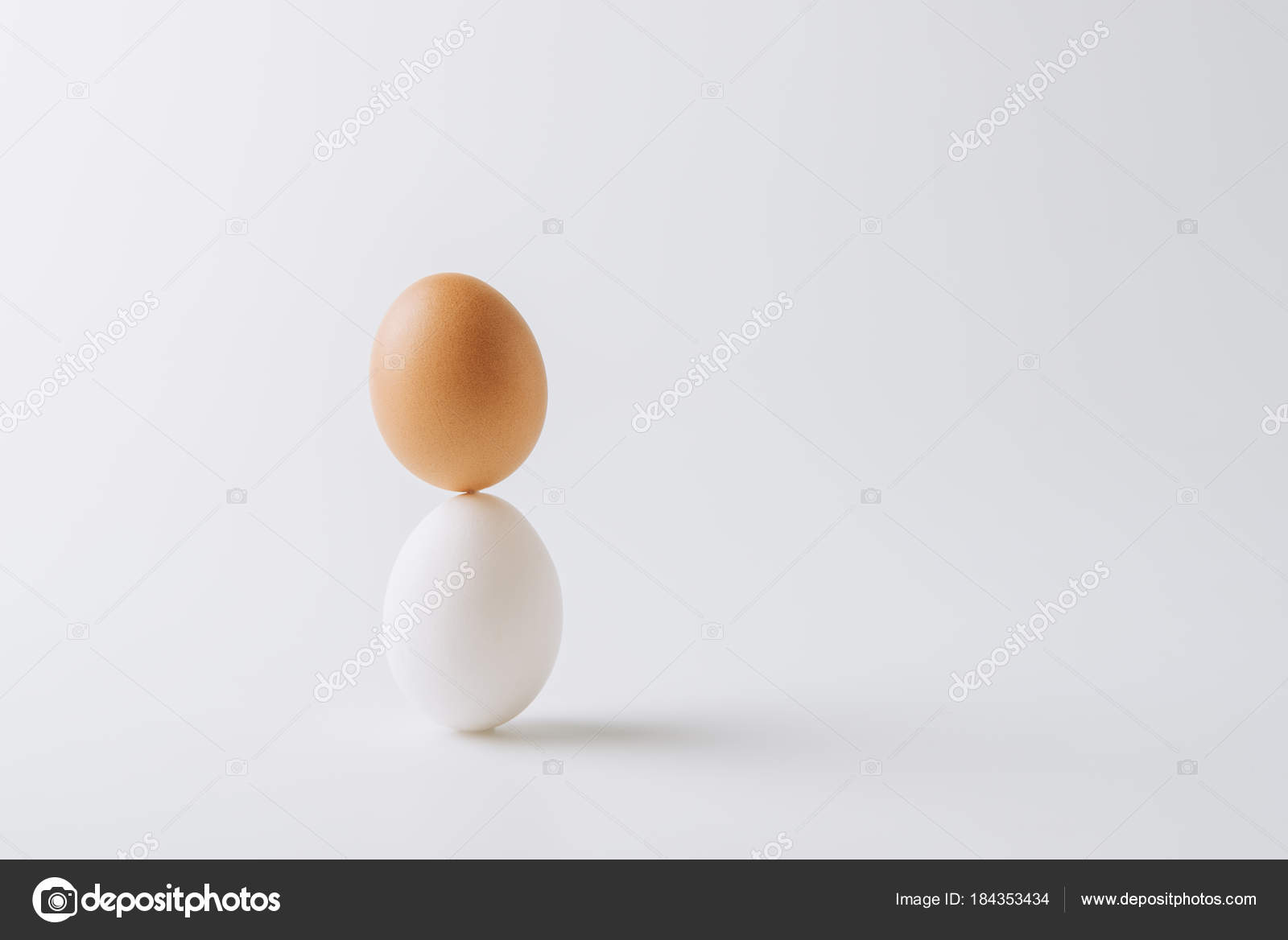 One White One Brown Eggs Stacked White Background Stock Photo by ©MicEnin  184353434