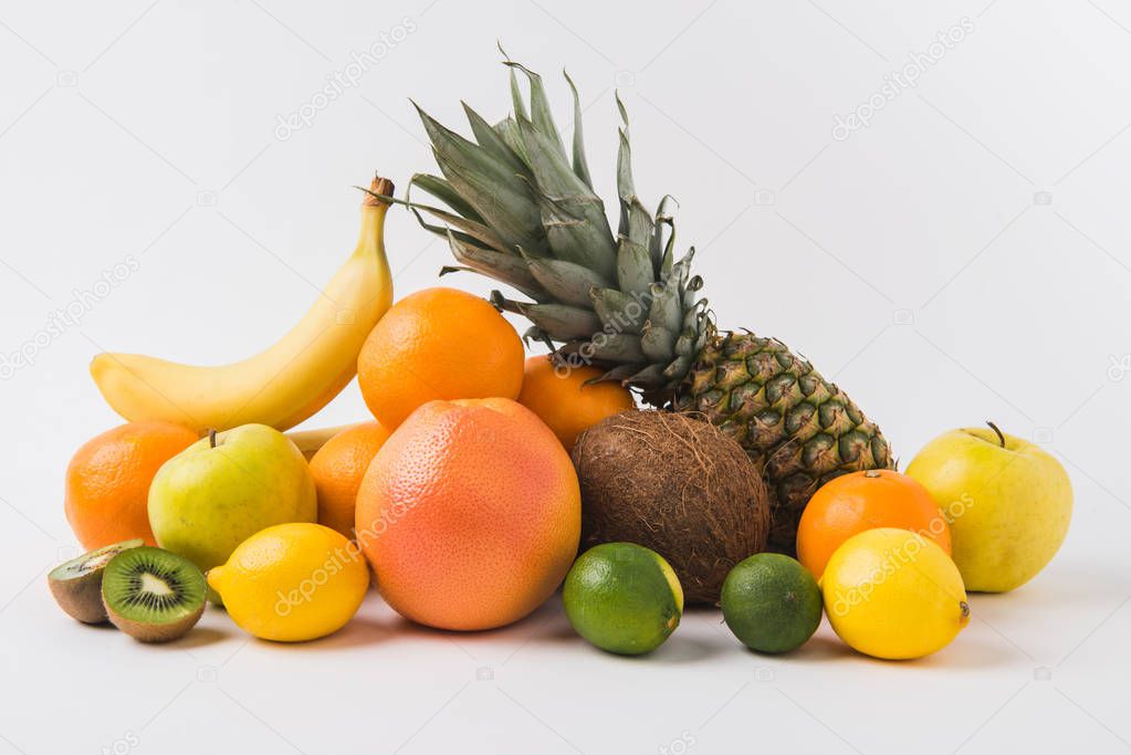 various fruits laying on white background