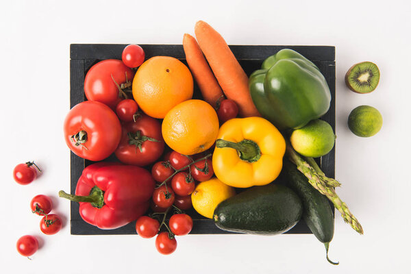 Farmers market concept with vegetables and fruits in dark wooden box isolated on white background