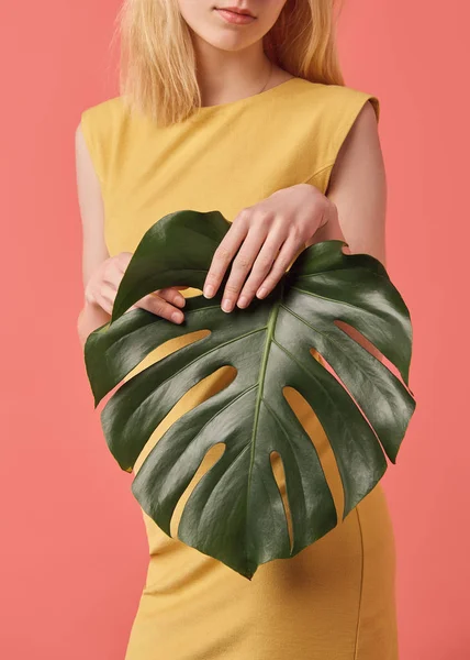 Cropped Shot Young Woman Monstera Leaf Isolated Red — Stock Photo, Image