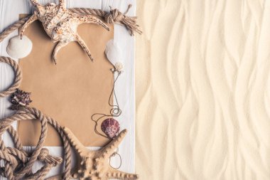 Summer travel template with seashells on sandy beach clipart
