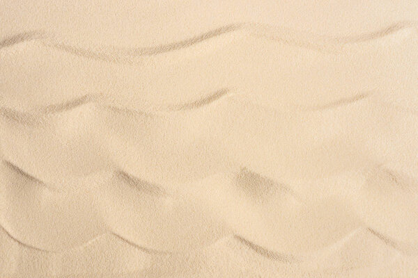 Wavy sandy beach texture for summer travel background