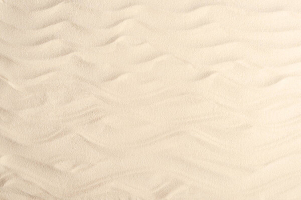 Waves on light sand for summer travel background 