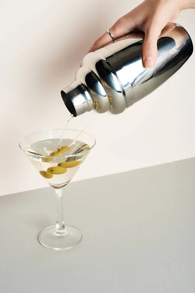 Cropped View Woman Pouring Martini Shaker Glass Olives — Stock Photo, Image