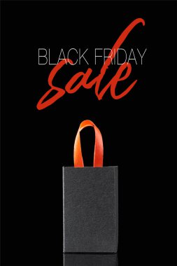 paper shopping bag with red handle isolated on black with black Friday sale illustration  clipart