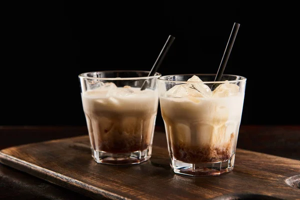 White Russian Cocktail Glasses Straws Wooden Board Isolated Black — Stock Photo, Image