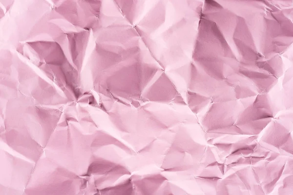 Close-up shot of crumpled pink paper for background — Stock Photo