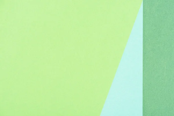 Close-up shot of paper layers of green and blue shades for background — Stock Photo