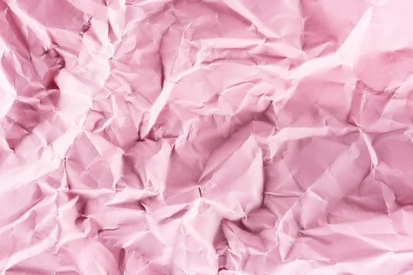 Close-up shot of crumpled pink paper for background — Stock Photo