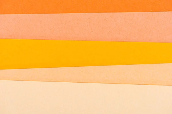 Close-up shot of orange shades paper layers for background — Stock Photo