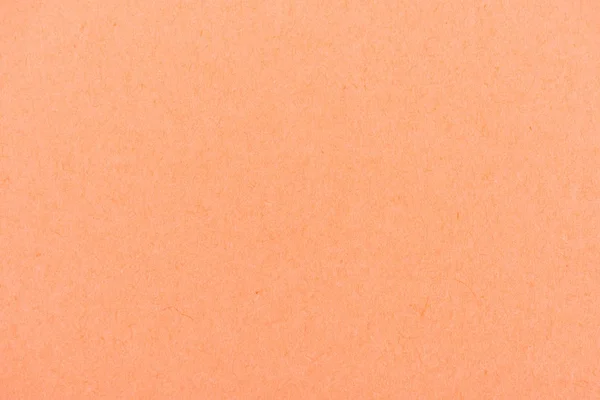 Textura de papel cor de pêssego-laranja como fundo — Fotografia de Stock