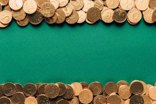 Top view of golden coins on green surface, st patricks day concept — Stock Photo